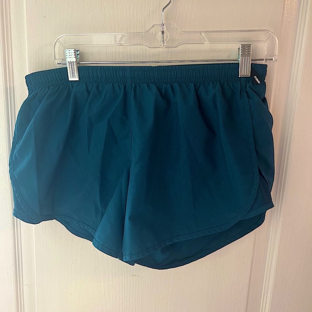 Nike running shorts. size m. teal color